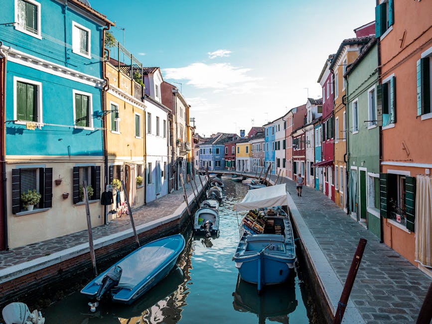 Venice narrow canal reflections midday