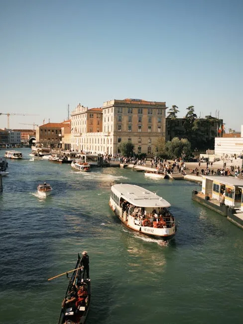 Gondola and ferry side by side canal scene