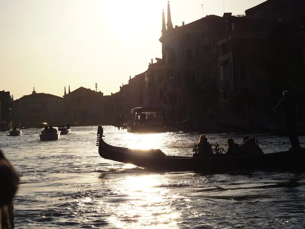 Sunset over Grand Canal gondolas silhouette