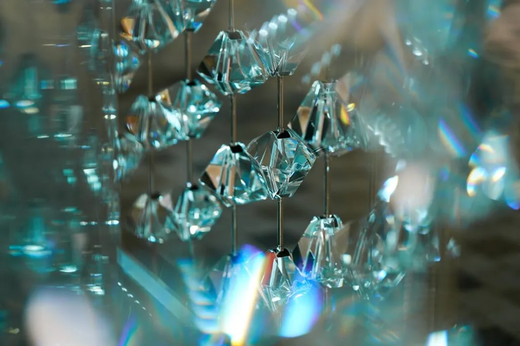 Close-up of sparkling Murano glass crystals reflecting prismatic light.